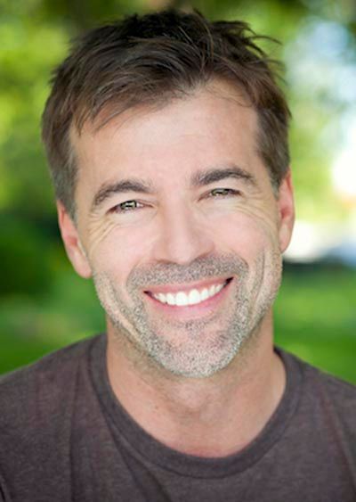 man showing off his new dental veneers he got at Prickly Pear Family Dental in Prescott, AZ